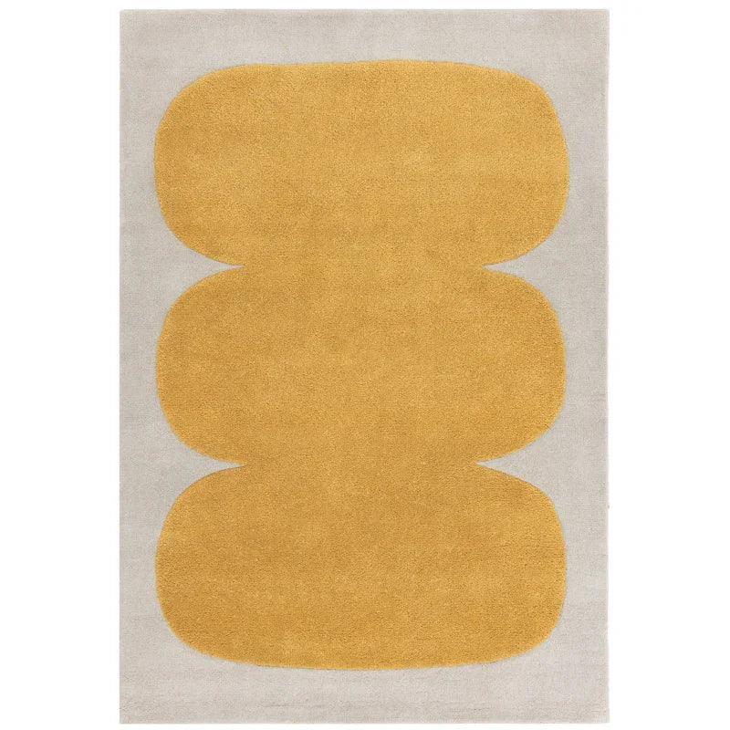 Modern area rug with abstract yellow geometric shapes on a light beige background