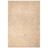 Beige and gold patterned area rug with raised abstract design, rectangular shape
