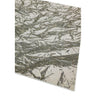 Modern area rug with abstract grey and white pattern corner view