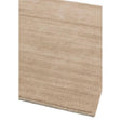 Beige area rug with subtle texture and finished edges viewed from an angle