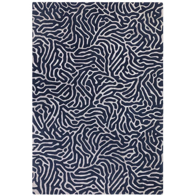 Navy patterned area rug with abstract silver line design