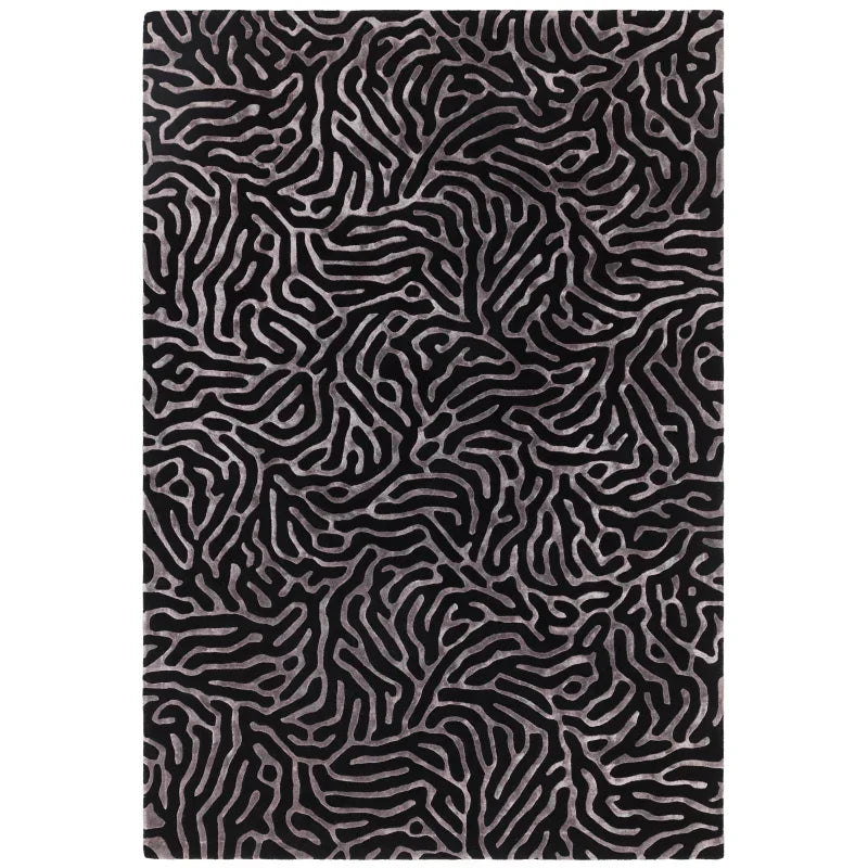 Black area rug with abstract silver line pattern, modern living room carpet design