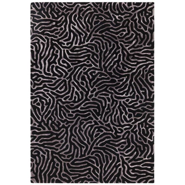 Black area rug with abstract silver line pattern, modern living room carpet design