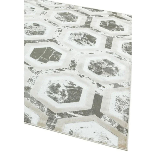 Modern area rug with grey geometric hexagon pattern on cream background