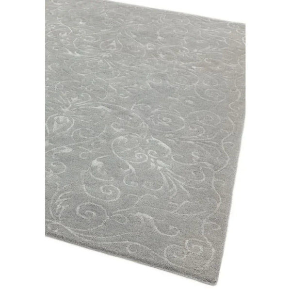 Light grey patterned rug with subtle floral details and soft textured finish