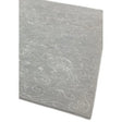 Light grey patterned rug with subtle floral details and soft textured finish