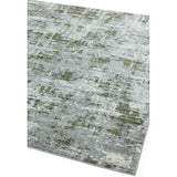 Modern area rug with abstract grey and green pattern, angled corner view on white background