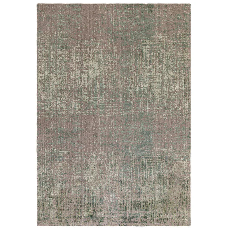 Distressed pattern area rug in muted green and beige tones, rectangular, shown from above