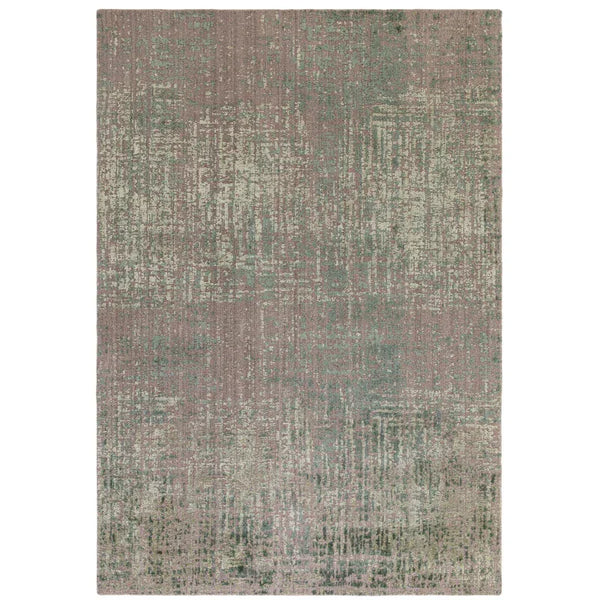 Distressed pattern area rug in muted green and beige tones, rectangular, shown from above