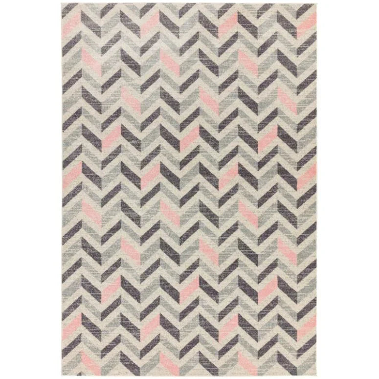 Chevron pattern rug with grey and pink accents on a light background