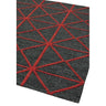Dark grey area rug with red geometric pattern and textured surface