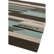 Modern geometric area rug with brown, beige, and teal pattern in close-up view