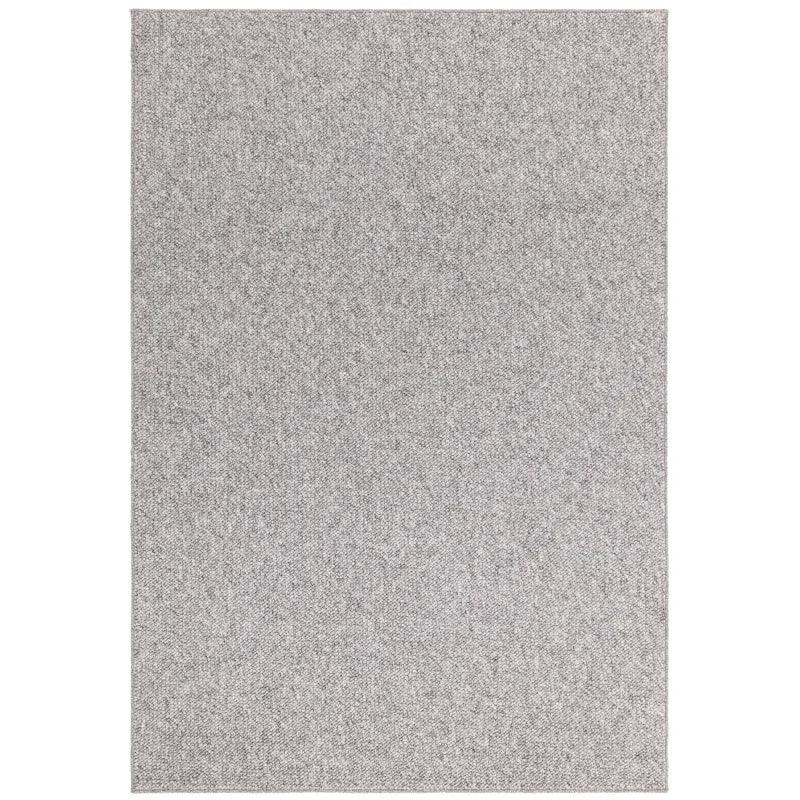 Large rectangular grey area rug with subtle woven texture