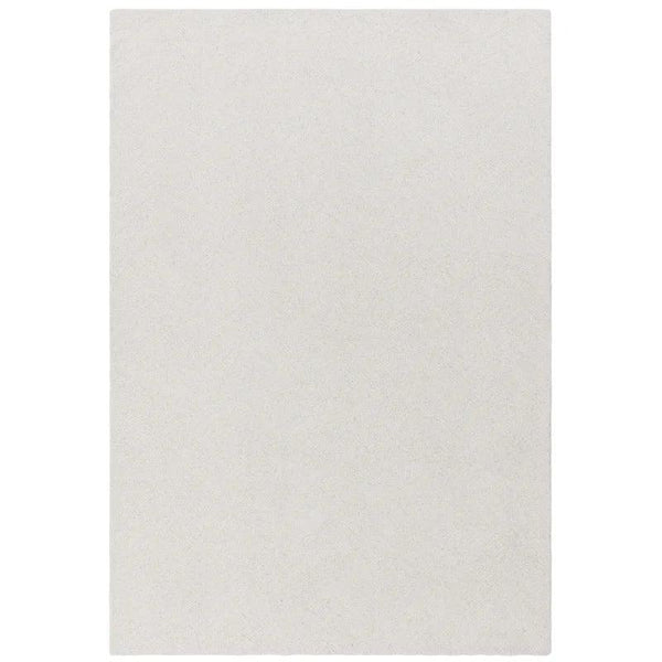Rectangular cream area rug with soft textured surface