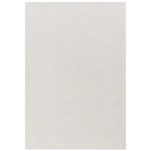 Rectangular cream area rug with soft textured surface