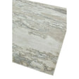 Modern area rug with grey and beige abstract pattern, angled corner view