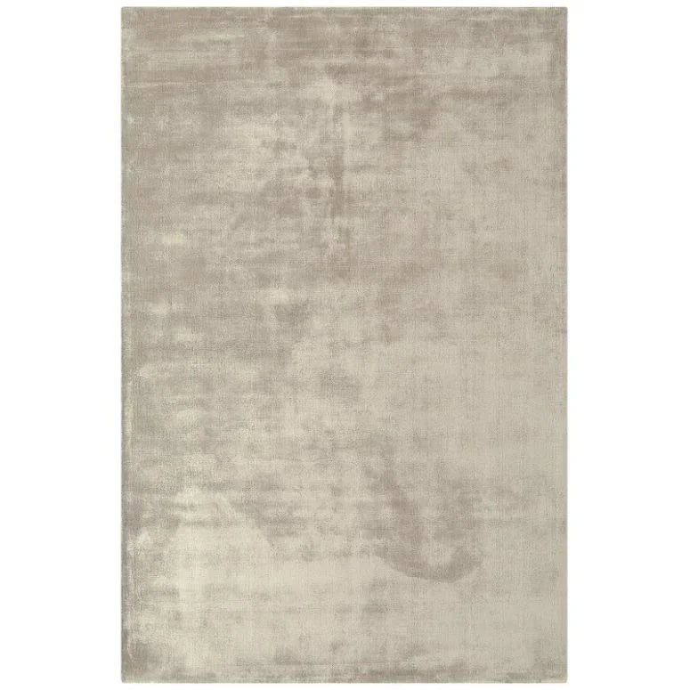 Large rectangular beige area rug with soft textured finish