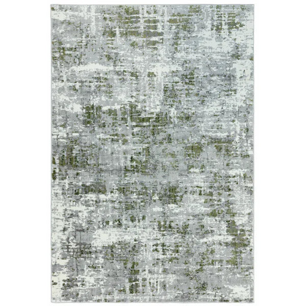 Abstract grey and green area rug with modern distressed pattern