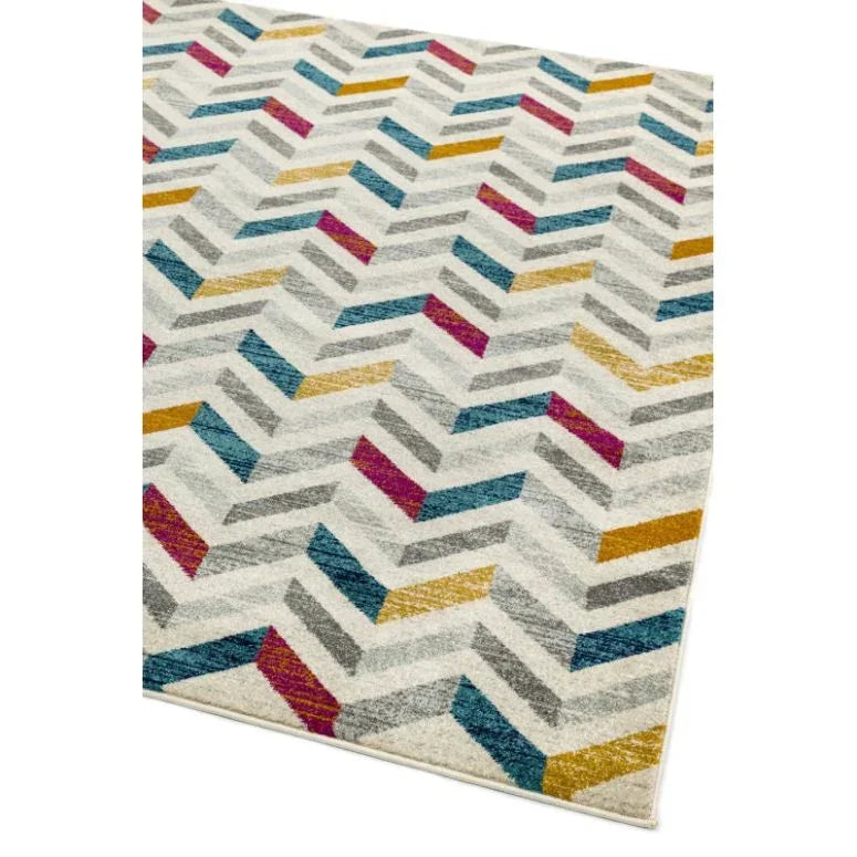 Chevron patterned rug with blue, yellow, grey and magenta accents on cream background