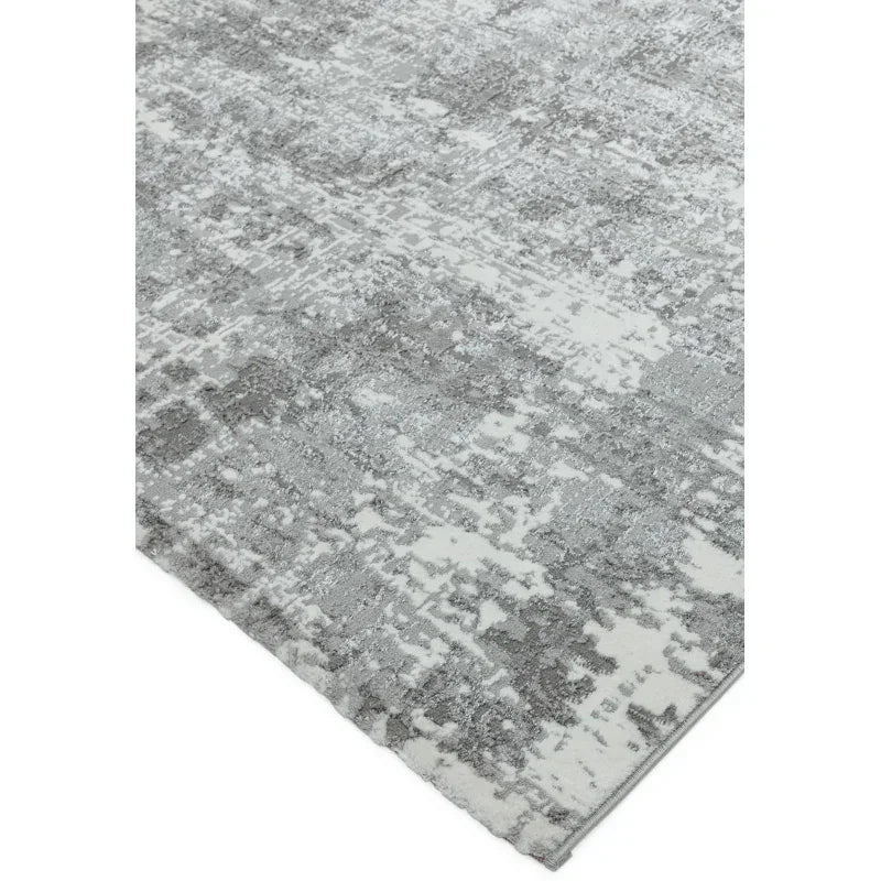 Grey and white abstract area rug with textured pattern corner view