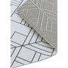 Beige and white geometric outdoor rug with detailed woven pattern corner fold