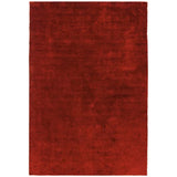 Red area rug with solid color and plush texture, rectangular shape, top-down view