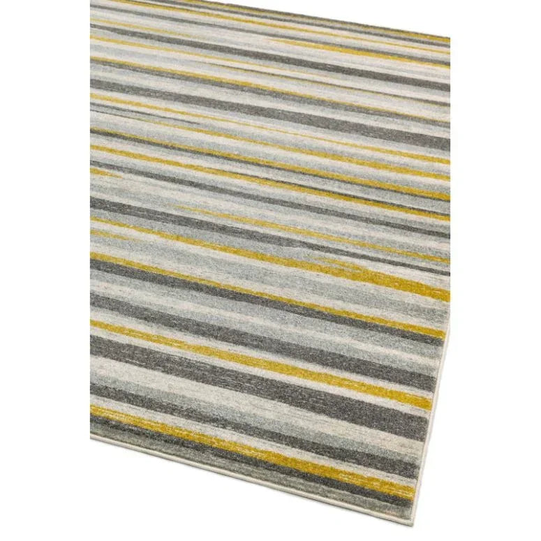 Striped area rug with grey, yellow, and white lines in a modern living room design