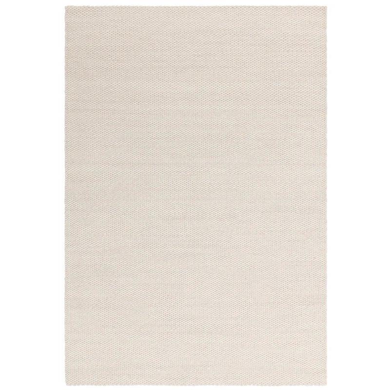 Rectangular cream woven rug with textured surface and clean edge detail