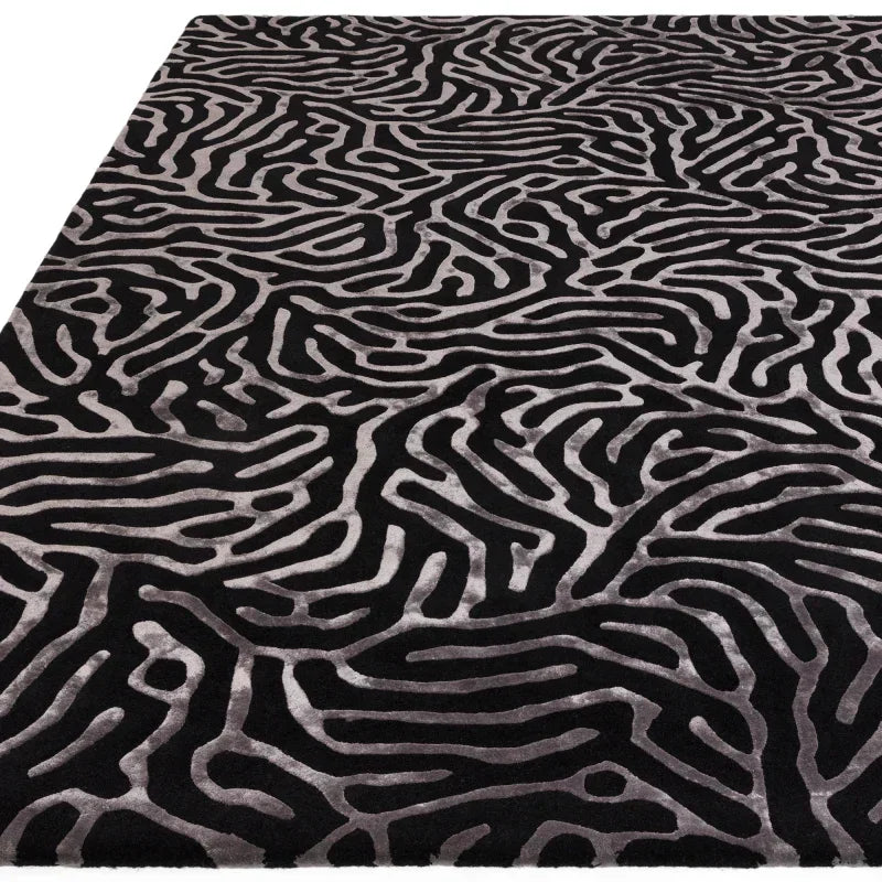 Black and grey abstract patterned rug with high-low textured surface