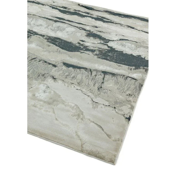 Modern area rug with grey and cream abstract pattern on white background