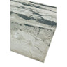 Modern area rug with grey and cream abstract pattern on white background