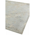 Modern area rug with abstract beige and grey pattern, shown from a corner angle