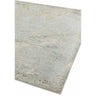 Modern area rug with abstract beige and grey pattern, shown from a corner angle