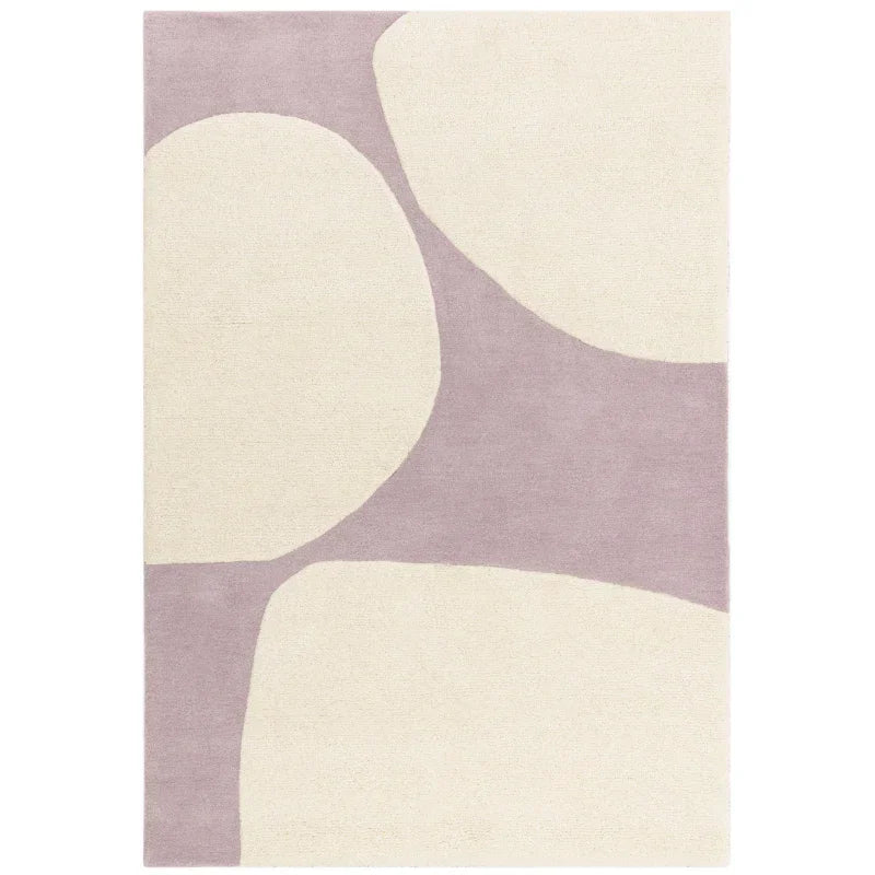 Modern area rug with abstract cream and lilac shapes, flat lay view