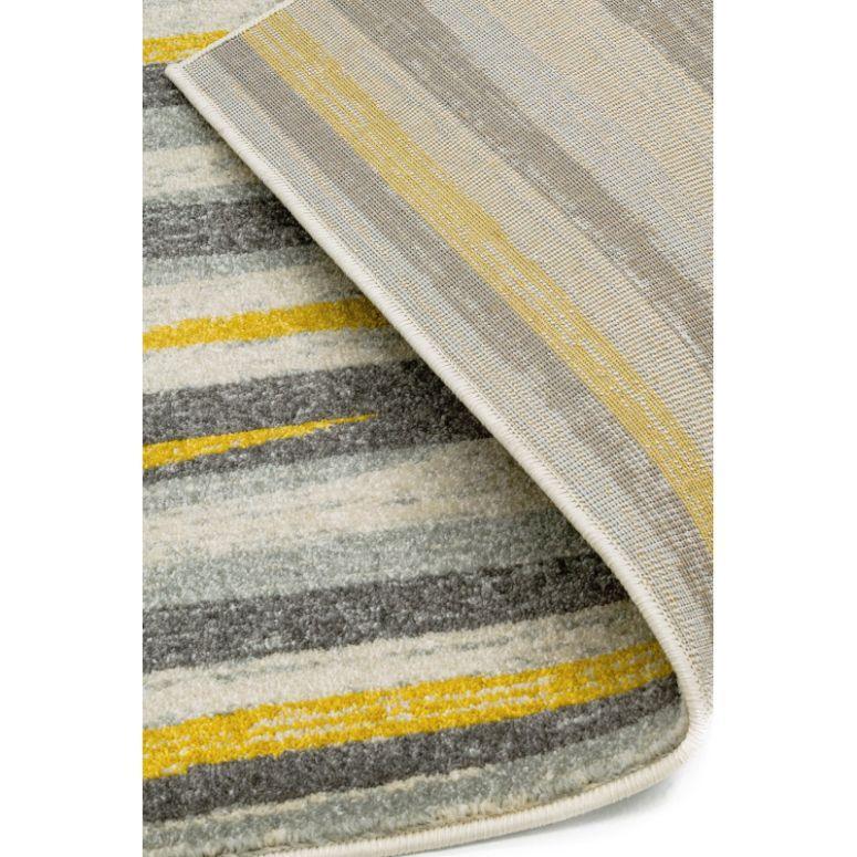 Striped area rug in grey, yellow and cream tones with corner folded to show underside