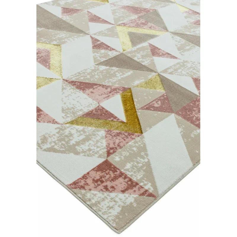 Geometric area rug with pink, beige, cream, and gold triangles