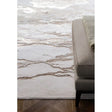 Beige marble effect rug beside taupe upholstered bench on wooden floor