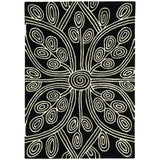 Black area rug with cream abstract swirl and leaf pattern