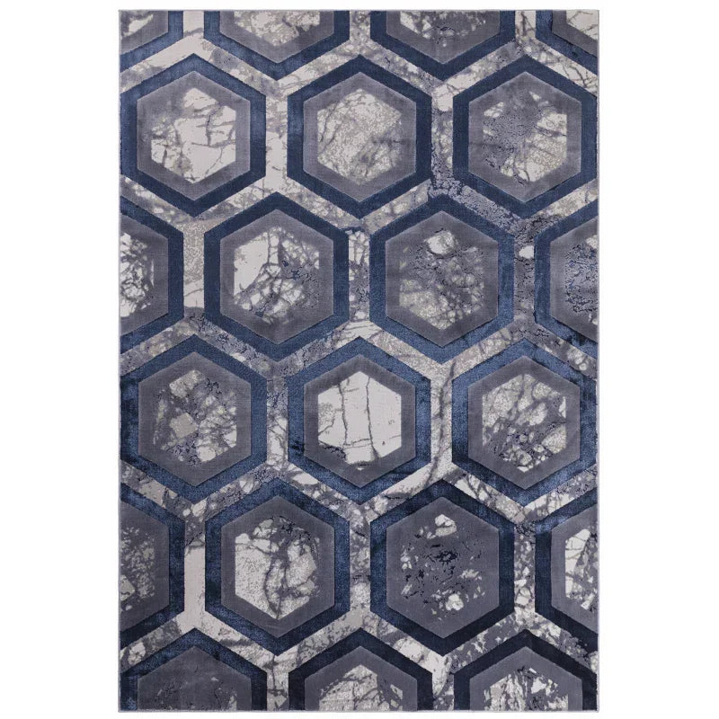 Blue geometric pattern rug with hexagonal marble effect design