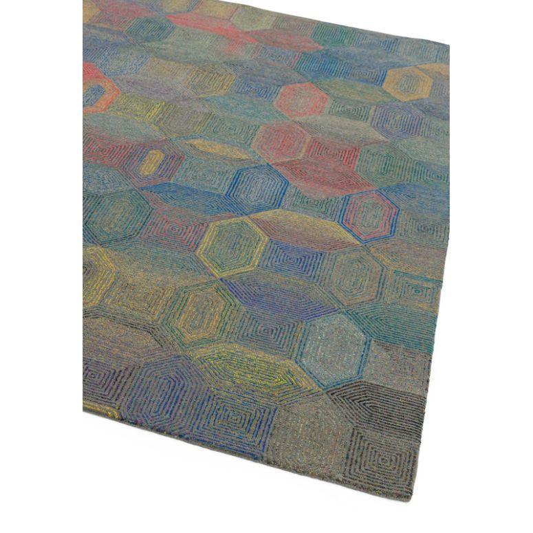 Geometric area rug with multicolour hexagon pattern on grey background