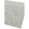 light grey modern rug with abstract linear pattern and textured finish, angled view
