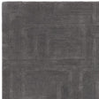Dark grey geometric pattern rug with subtle texture, shown from overhead angle