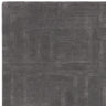 Dark grey geometric pattern rug with subtle texture, shown from overhead angle