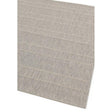 Grey woven area rug with subtle stripe pattern corner detail