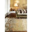 Modern abstract area rug on wooden floor with striped sofa and gold table lamp