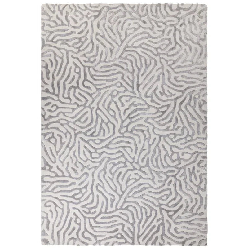 Grey abstract pattern area rug with textured surface and modern design