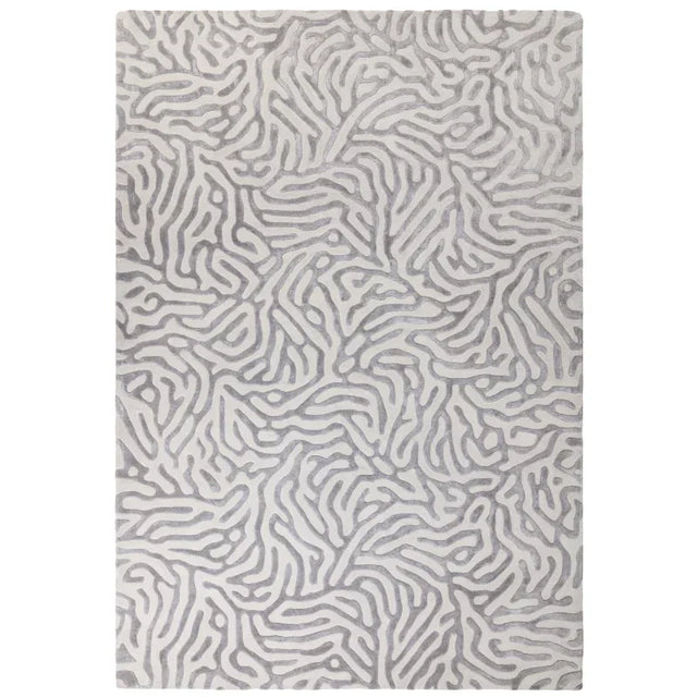 Grey abstract pattern area rug with textured surface and modern design