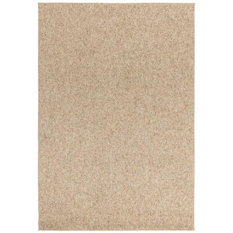 Beige textured area rug with subtle woven pattern and short pile
