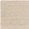 Close-up of cream woven wool rug corner showing textured braided pattern