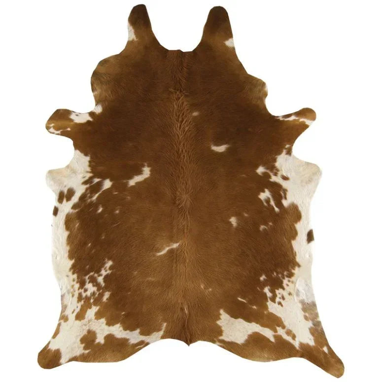 Brown and white cowhide rug with natural shape and distinctive pattern